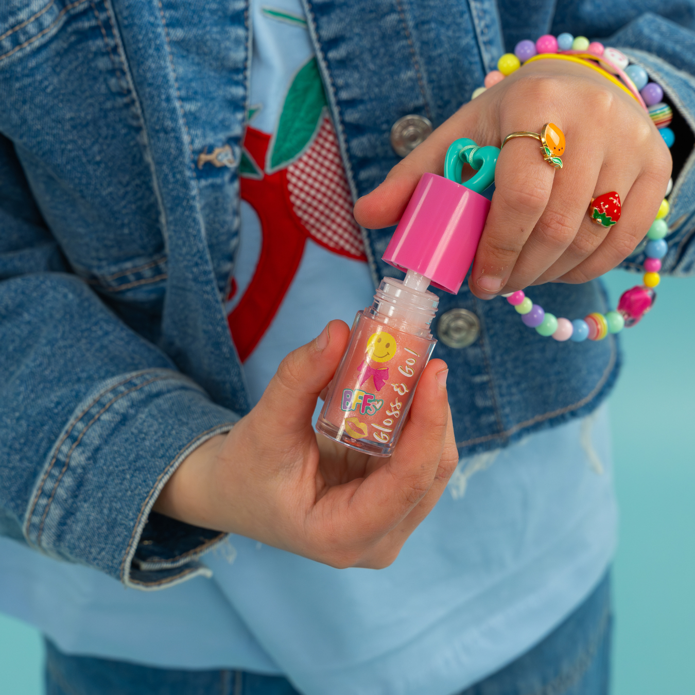 Peach flavoured lip gloss with charm